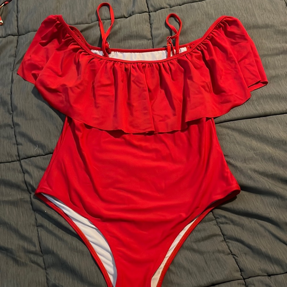 Red one-piece swimsuit. Can be worn 3 separate ways! Perfect for 4th of July!